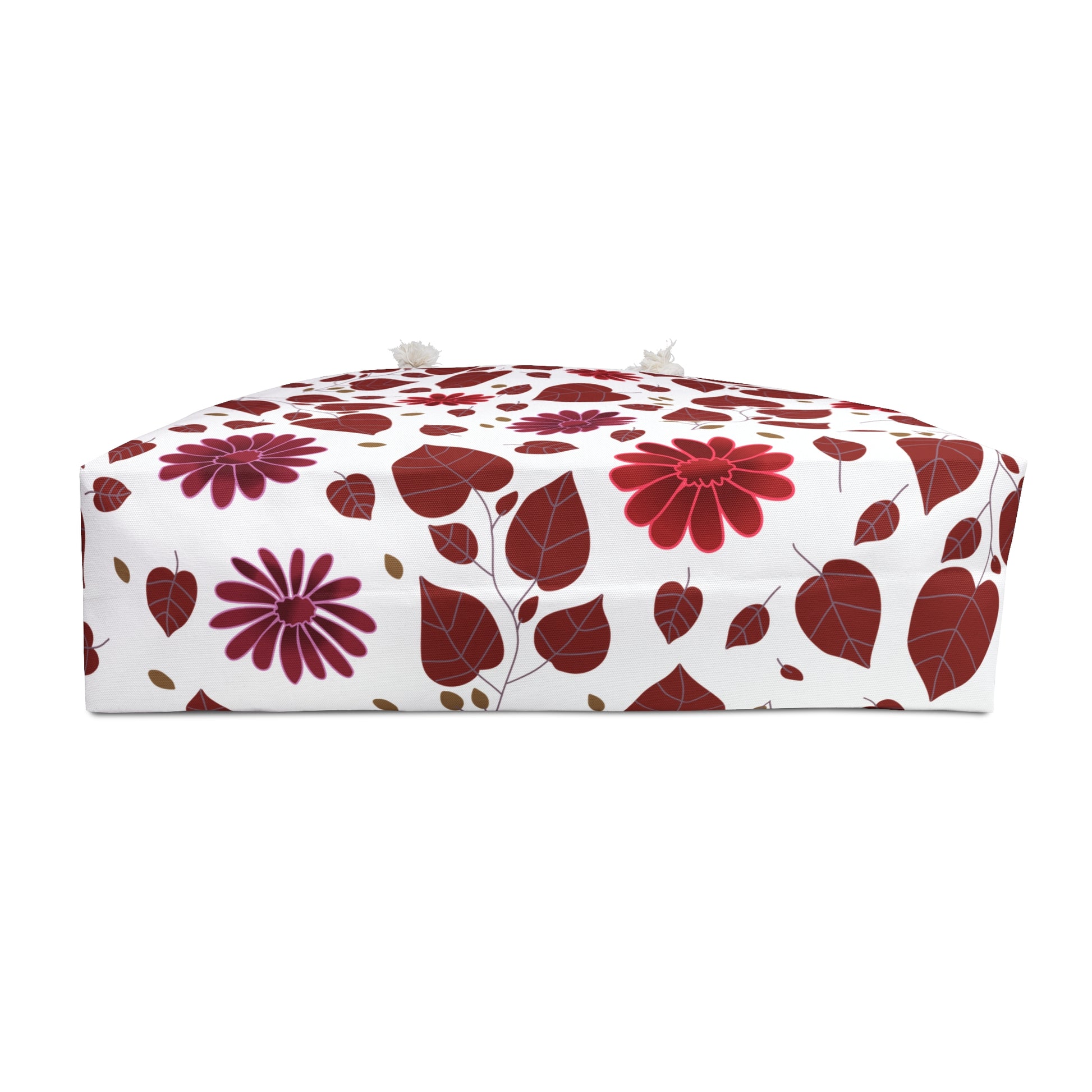 Weekender Bag featuring a white floral pouf design with red and magenta flowers, tasseled handles, and a domed top. Ideal for stylish, joyful travels, enhancing comfort and ease.