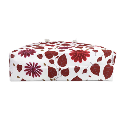 Weekender Bag featuring a white floral pouf design with red and magenta flowers, tasseled handles, and a domed top. Ideal for stylish, joyful travels, enhancing comfort and ease.