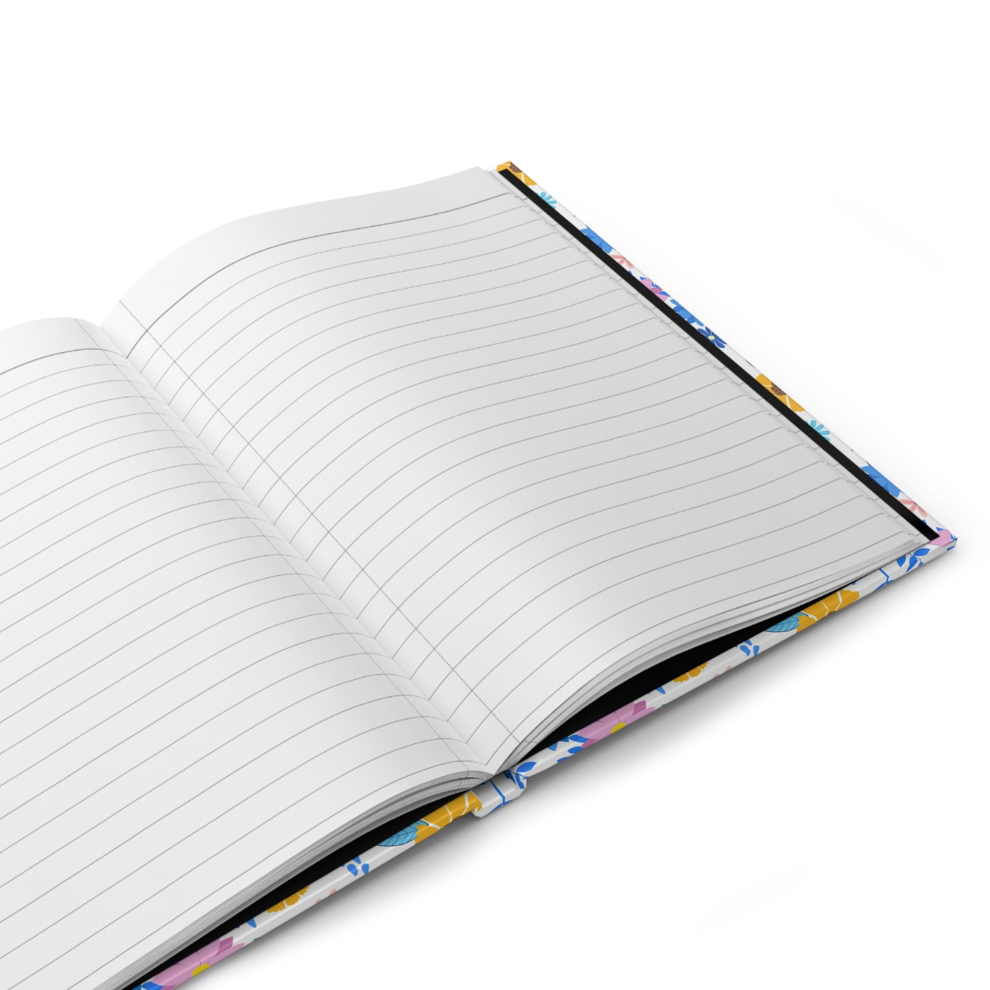HARDCOVER JOURNAL, MATTE, RULED, 5X7, SEWN BIND, CLEAN-TEAR PAGES – CHEERFUL BLOOMS MIX features open, lined pages with a glimpse of its vibrant floral cover, reflecting FireBrook Essentials' joyful, uplifting design ethos.