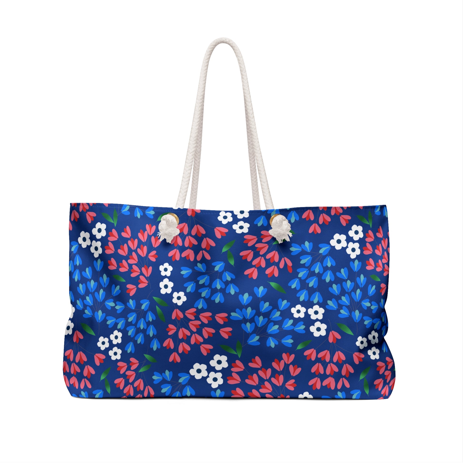 Weekender Bag with dark navy floral print, featuring thick rope handles and a cream-lined interior. Perfect for stylish travel with a spacious, wrinkle-resistant design, ideal for vacations and weekend getaways.