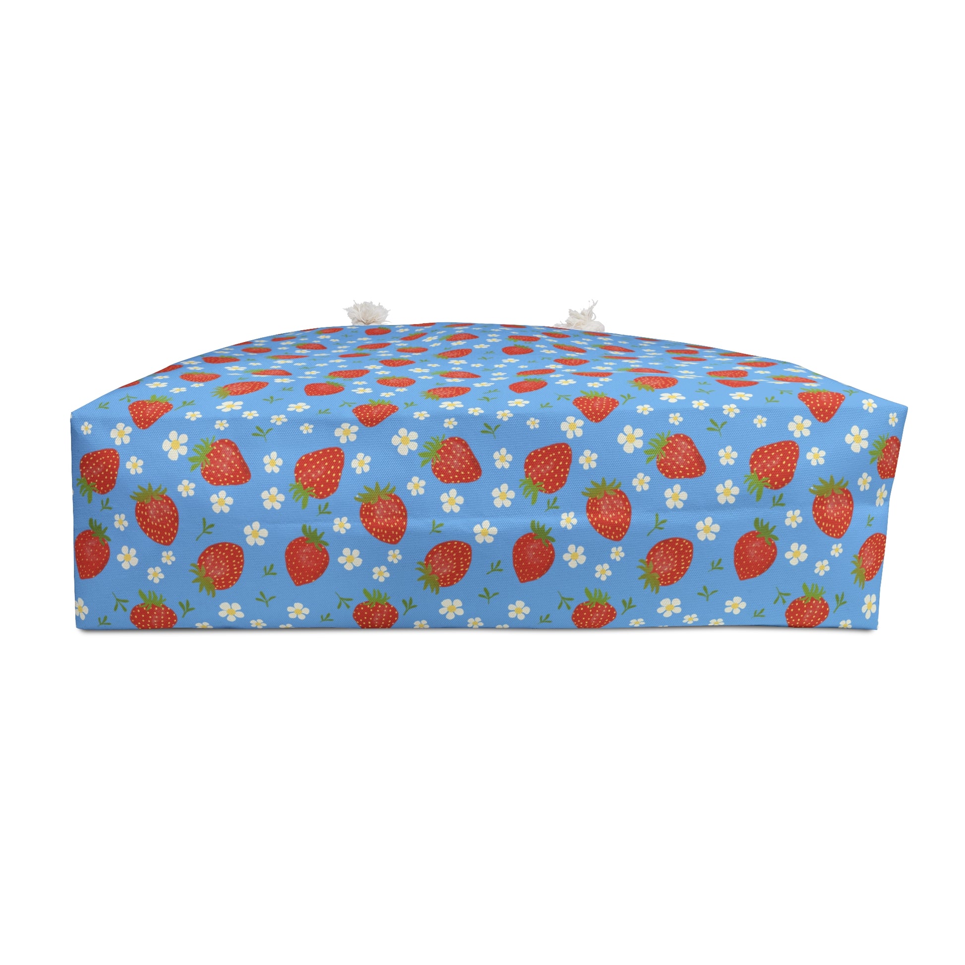 Weekender Bag with Strawberry Design: A stylish travel bag featuring a close-up strawberry pattern, perfect for weekend getaways, with rope handles and a cream sheeting interior for durability.