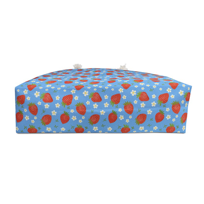 Weekender Bag with Strawberry Design: A stylish travel bag featuring a close-up strawberry pattern, perfect for weekend getaways, with rope handles and a cream sheeting interior for durability.