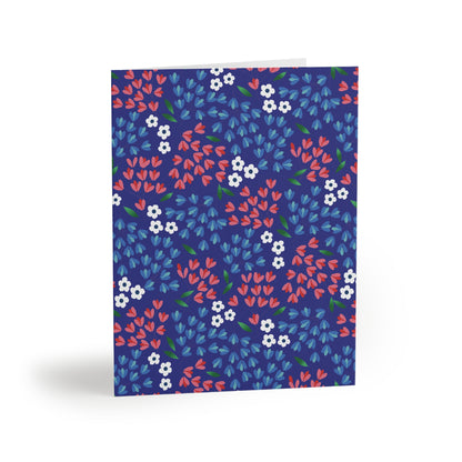 Floral Wildflower Greeting Cards — Pack of 8/16/24, featuring a vibrant floral pattern on a deep blue background, elegantly folded and ready to personalize. Includes matching white envelopes, perfect for heartfelt messages.