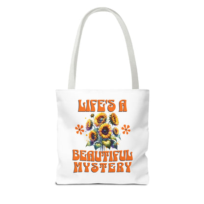 Life's A Beautiful Mystery Tote Bag featuring orange text and floral design, ideal for daily adventures and celebrating life's surprises.