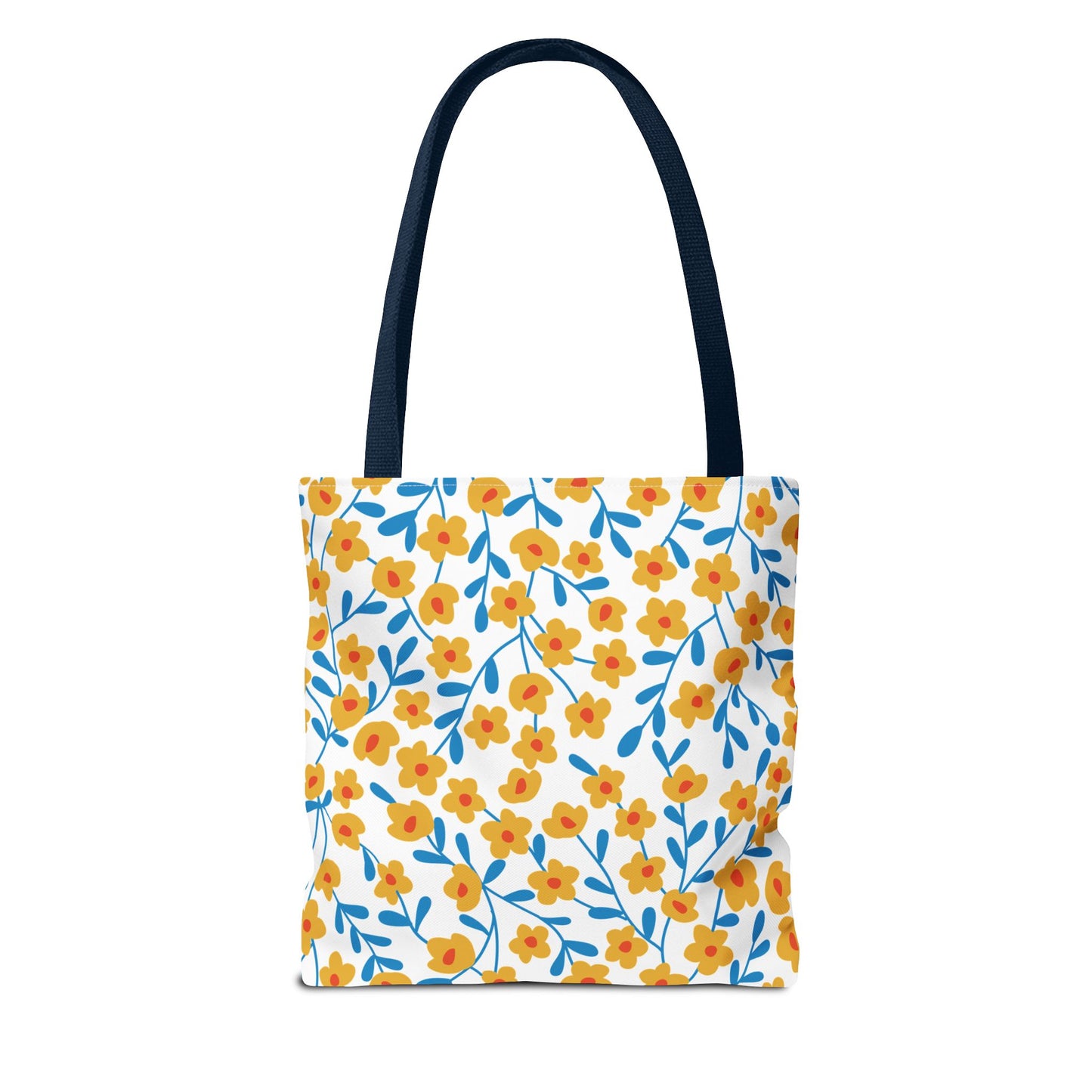 Floral Tote Bag with a white canvas body, adorned with cheerful yellow-orange flowers and blue leafy stems. Features long dark shoulder straps, perfect for summer outings and adding joy to your day.