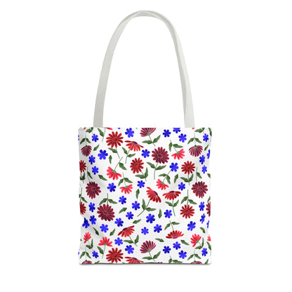 Floral Pattern Tote Bag — Red & Blue Wildflower All-Over Print features a cheerful floral design with red daisies and blue blooms on white, perfect for stylishly carrying essentials with a cottage charm.