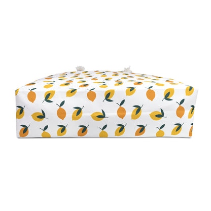 Lemon Print Weekender Bag - Travel Tote featuring a vibrant lemon pattern and green leaves. The spacious, stylish design with comfortable rope handles is perfect for beach, gym, or yoga trips.