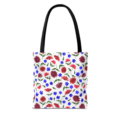 Floral Pattern Tote Bag — Red & Blue Wildflower All-Over Print: A white tote bag featuring vibrant red daisies and blue flowers with green stems, black handles, and spacious boxed corners for versatile everyday use.