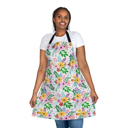 Person wearing a Floral Apron with vibrant multicolored flowers, showcasing FireBrook Essentials' commitment to comfort and style. The apron features a tie-back closure, ideal for cooking or crafting.