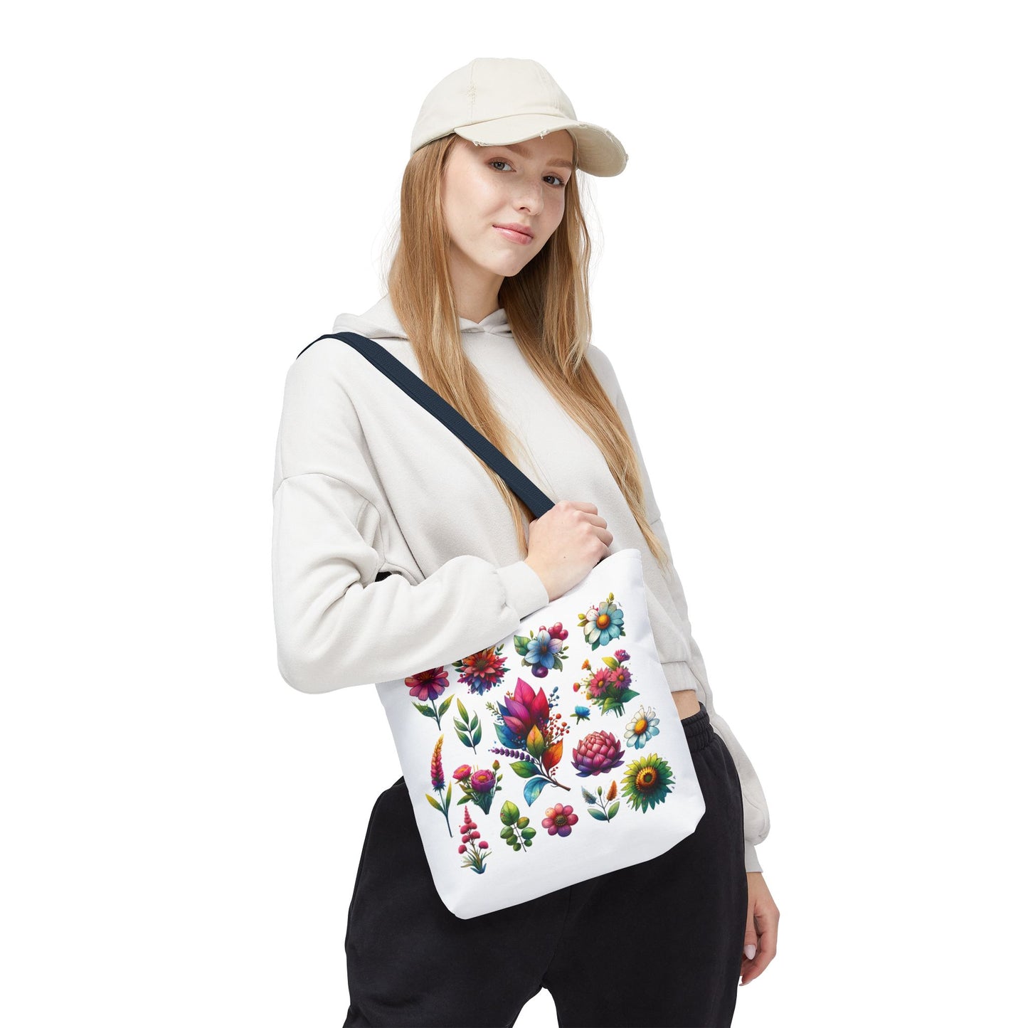 Floral Tote Bag held by a woman in a white sweatshirt and hat, showcasing its nature-inspired design and ideal for daily essentials.