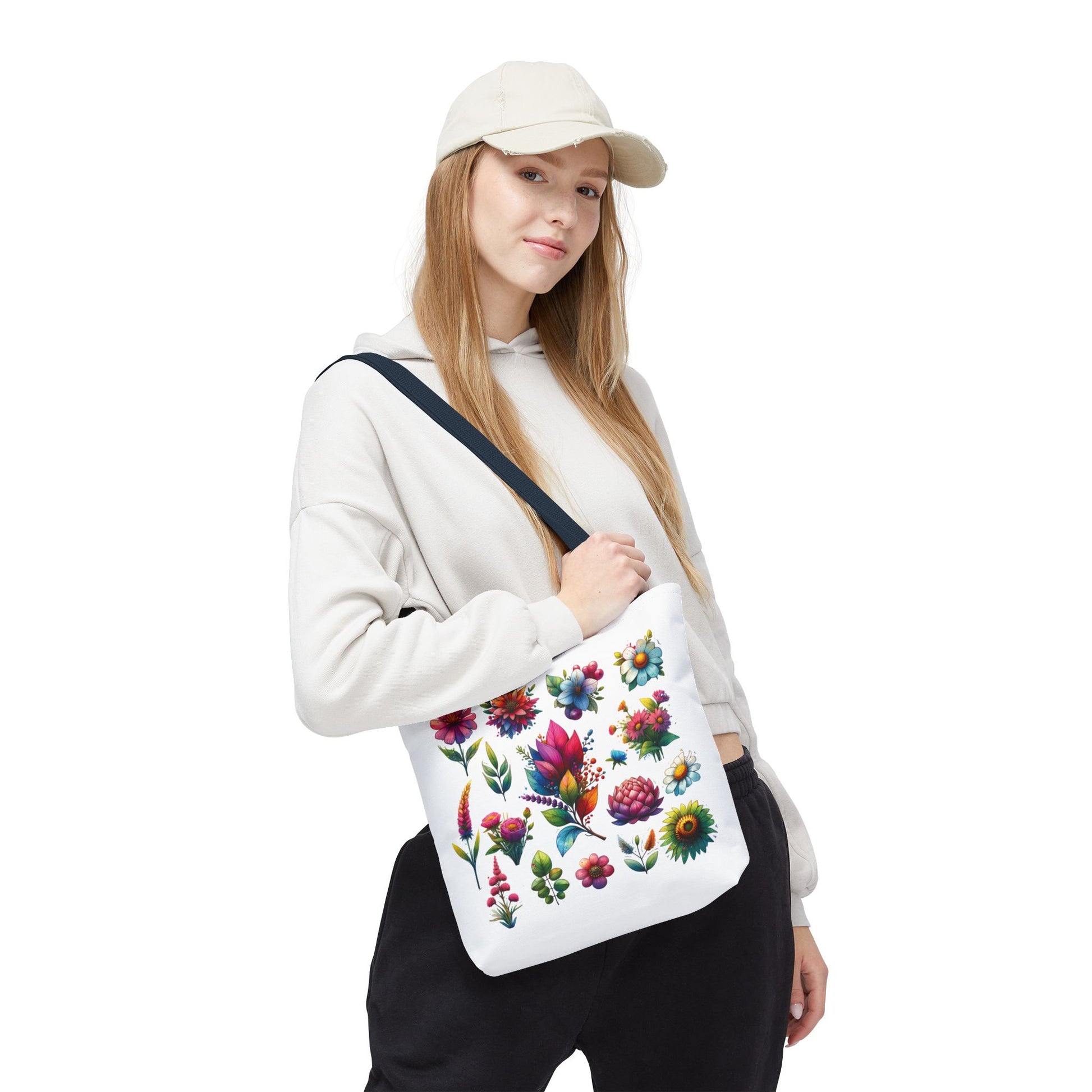 Floral Tote Bag held by a woman in a white sweatshirt and hat, showcasing its nature-inspired design and ideal for daily essentials.