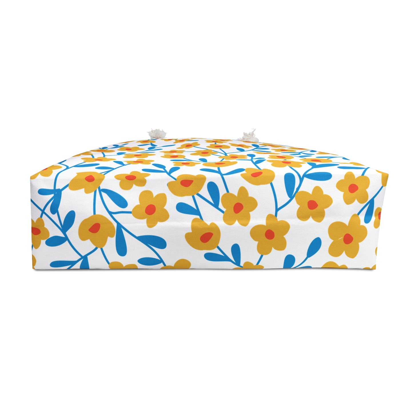Weekender Bag featuring a vibrant white fabric with yellow floral patterns and blue stems, complemented by rope handles for easy carrying. Perfect for stylish, comfortable travel.
