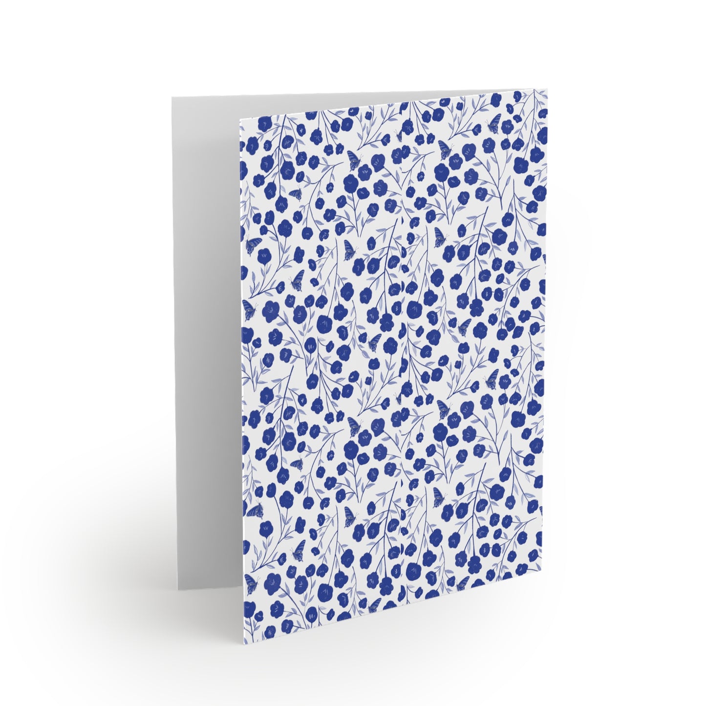 Floral Greeting Cards — Pack of 8/16/24, featuring a matte-finish cover with a repeating pattern of blue flowers and leafy branches. Blank inside, each card includes a matching white envelope.