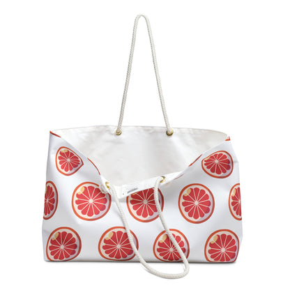 Weekender Bag Orange Slices Print with vibrant fruit design, featuring durable spun polyester, cream rope handles, and spacious interior. Ideal for cheerful summer getaways, aligning with FireBrook's uplifting and joyful style.