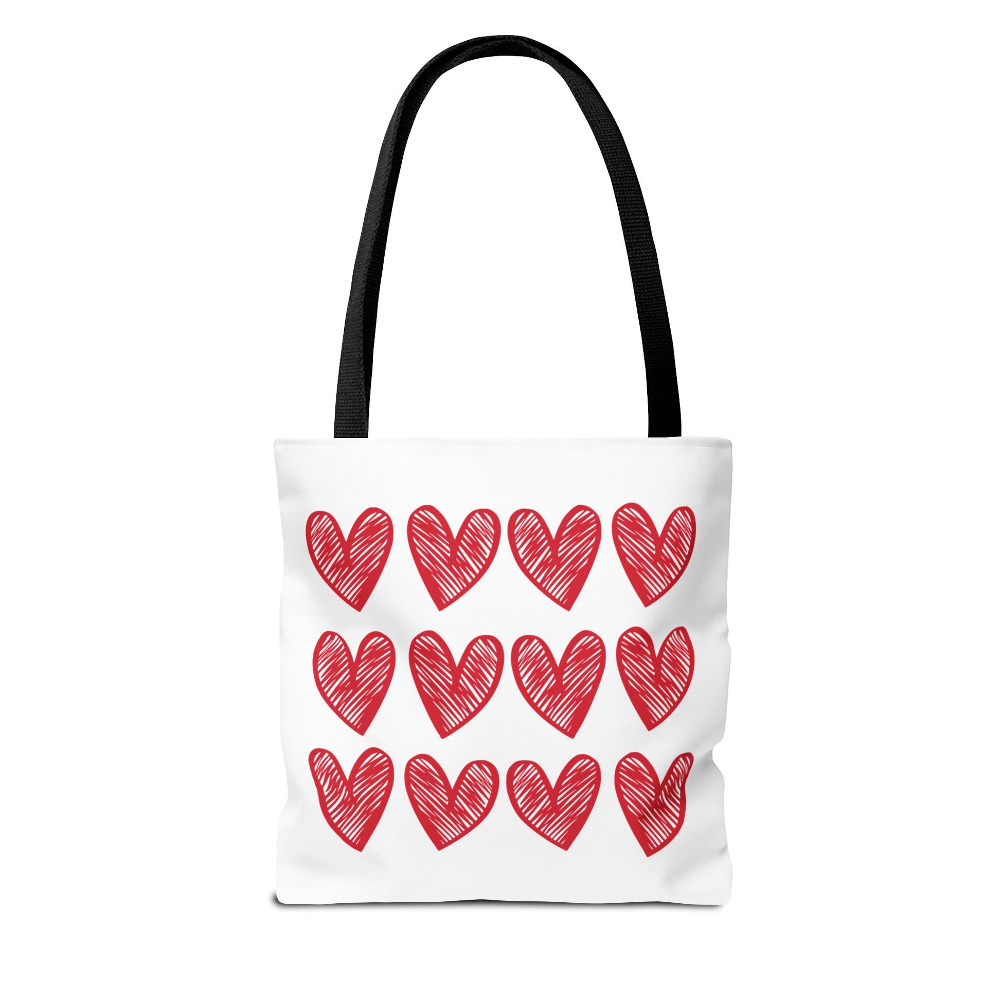 Hearts Tote Bag featuring a white base adorned with red hearts, embodying FireBrook Essentials' uplifting style. Designed with reinforced handles and boxed corners for durability and space, perfect for adding love to any outfit.