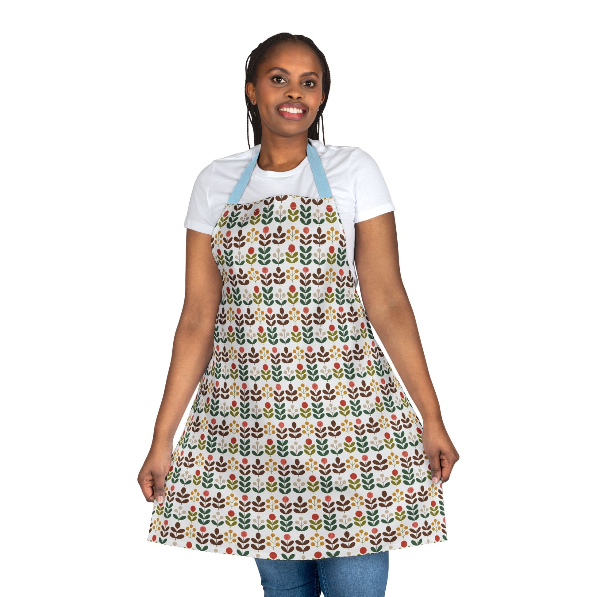 Flower Pattern Apron showcased on a smiling woman, highlighting its vibrant floral design and comfortable fit, ideal for creative cooks or artists, embodying FireBrook Essentials' uplifting style and practicality.