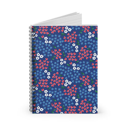 Floral Spiral Notebook with a deep blue cover featuring red-pink flowers, light blue leaves, and white blossoms, showcasing FireBrook Designs' commitment to stylish, uplifting everyday essentials.