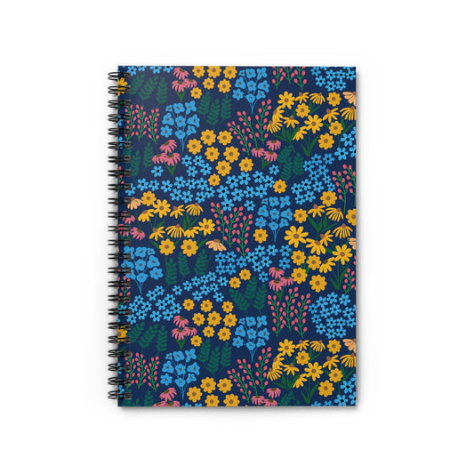 Floral Spiral Notebook with navy-blue cover, adorned with vibrant yellow, light blue, pink, and green wildflowers, featuring sleek metal spiral binding, perfect for creative note-taking and organization.
