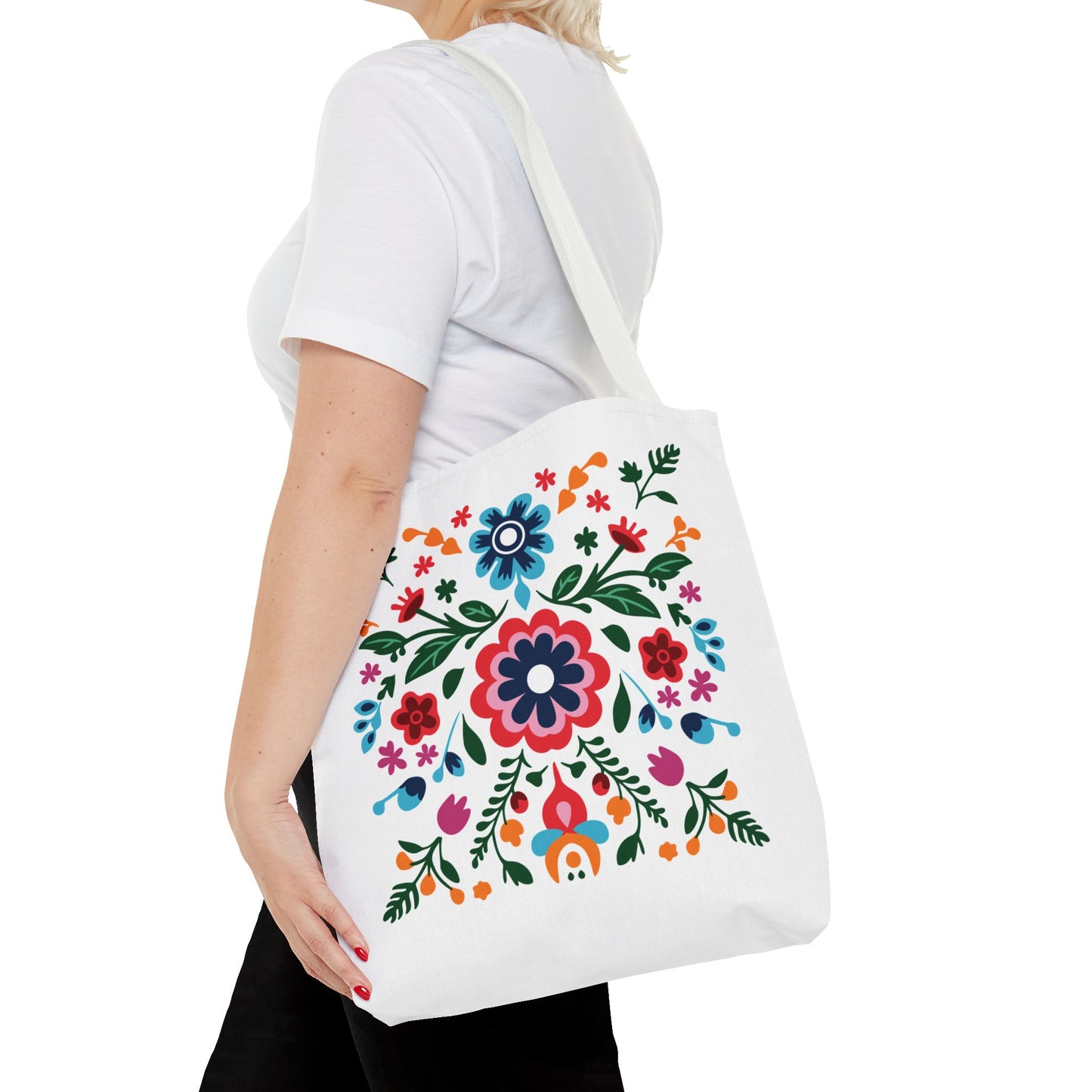 Woman holding a Floral Tote Bag with colorful flower patterns, showcasing a stylish and practical design for everyday use.
