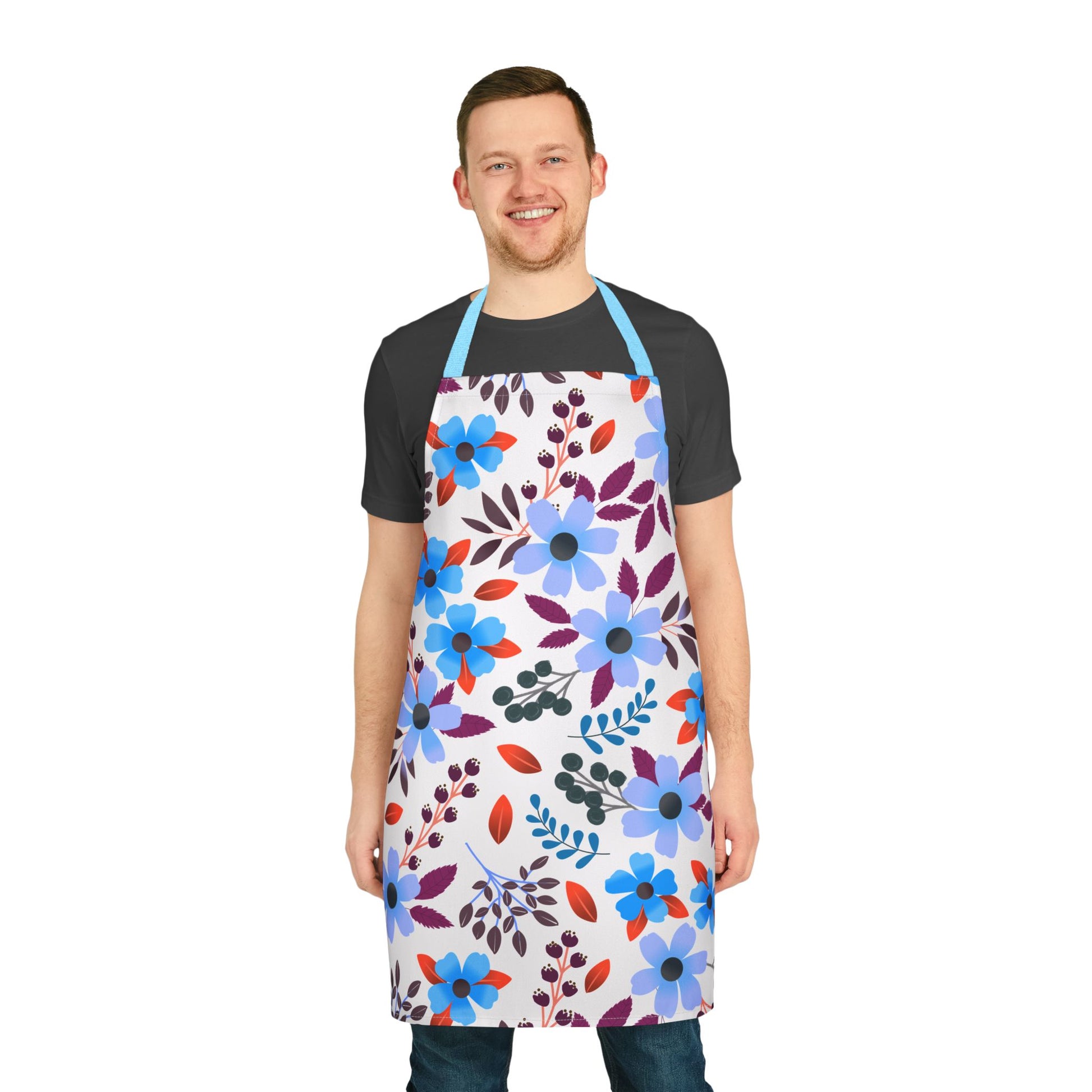 Floral Apron: A man models a stylish apron with vibrant blue and lavender floral prints, designed for comfort and stain resistance, ideal for cooking or crafting. Perfectly embodies FireBrook Essentials' uplifting design ethos.