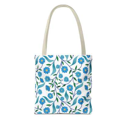 Blue Floral Tote Bag with natural-beige straps, featuring vibrant blue daisies and green leaves on a white background. Ideal for summer outings, offering durability and style from FireBrook Essentials.