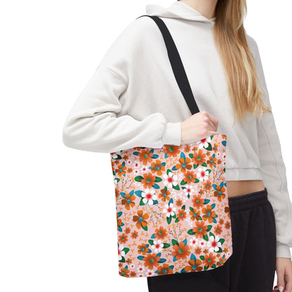 Peach Poppy Grove Tote Bag draped over shoulder, showcasing a vibrant floral pattern on pale pink. Ideal for joyful summer outings, embodying FireBrook Designs' blend of style and functionality.