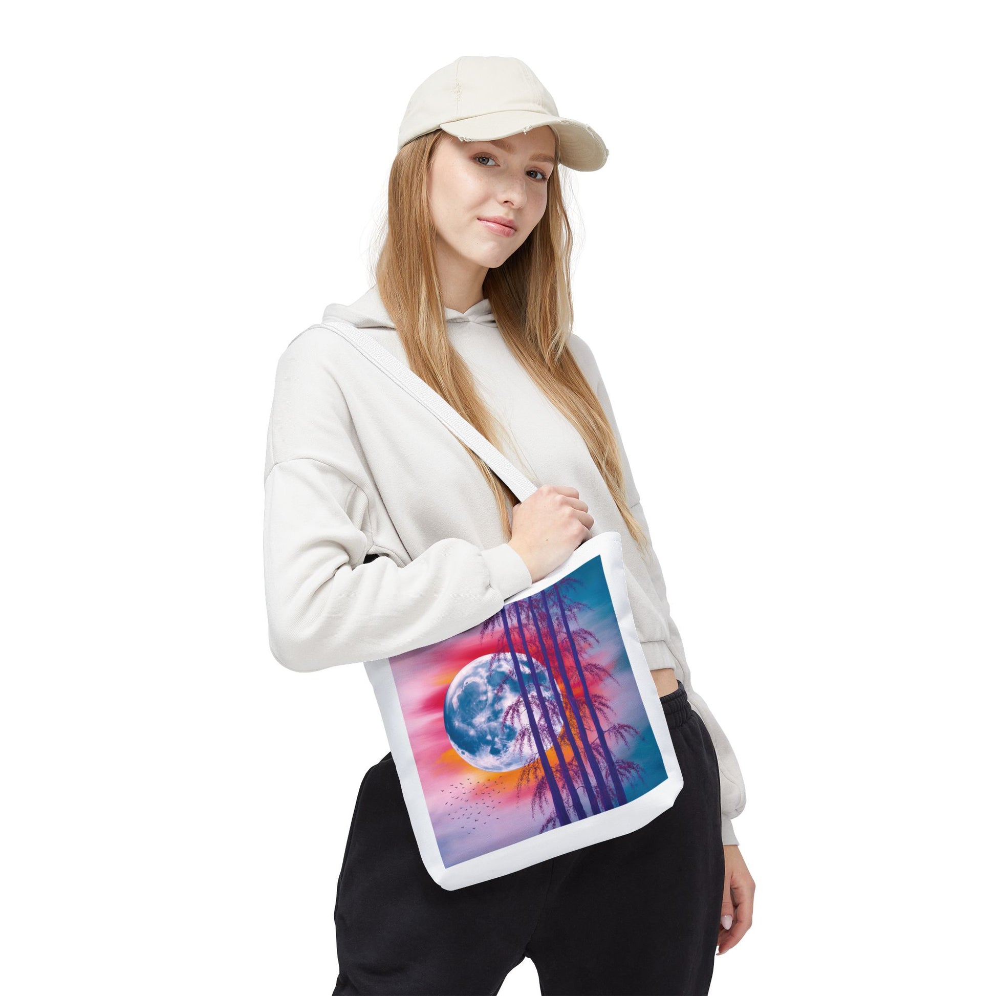 Moonlit Landscape Tote Bag features a vibrant full moon scene with silhouetted trees, embodying an abstract painting style. Ideal for nature enthusiasts, it's durable, spacious, and perfect for everyday use or gifting.