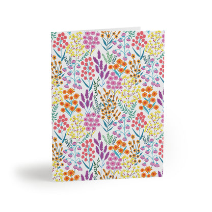 Floral Wildflower Greeting Cards — Pack of 8/16/24, featuring hand-drawn wildflowers in vibrant colors across a matte-finish white background, perfect for adding a cheerful, springtime touch to any message.