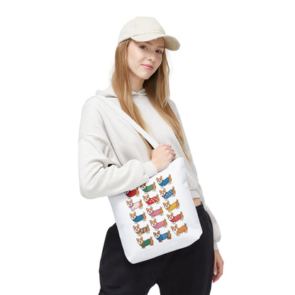 Cheerful Corgi Cartoon Style Dog Lover Tote Bag features cute Corgis in fun outfits on a durable polyester fabric, ideal for dog enthusiasts seeking a whimsical, everyday accessory from FireBrook Essentials.