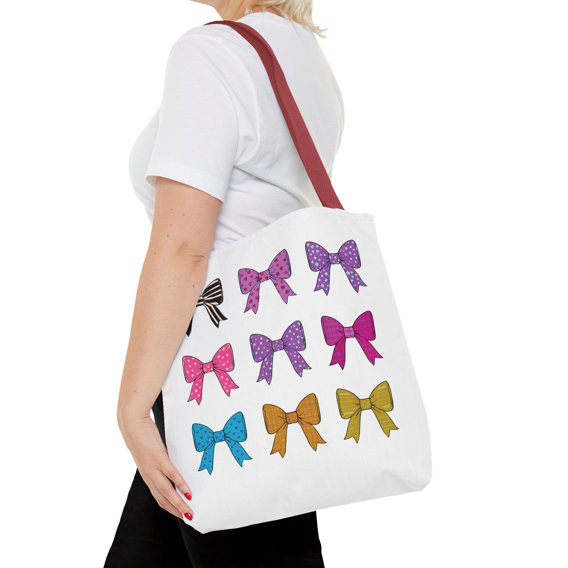 Woman holding Bows Ribbons Tote Bag featuring playful bow prints, ideal for stylish, practical use. Perfect for shopping or travel with ample space and durability.
