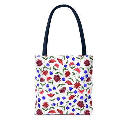 Floral Pattern Tote Bag — Red & Blue Wildflower All-Over Print: A white canvas tote with vibrant floral design, featuring navy handles and boxed corners. Perfect for market trips, with reinforced stitching for durability.