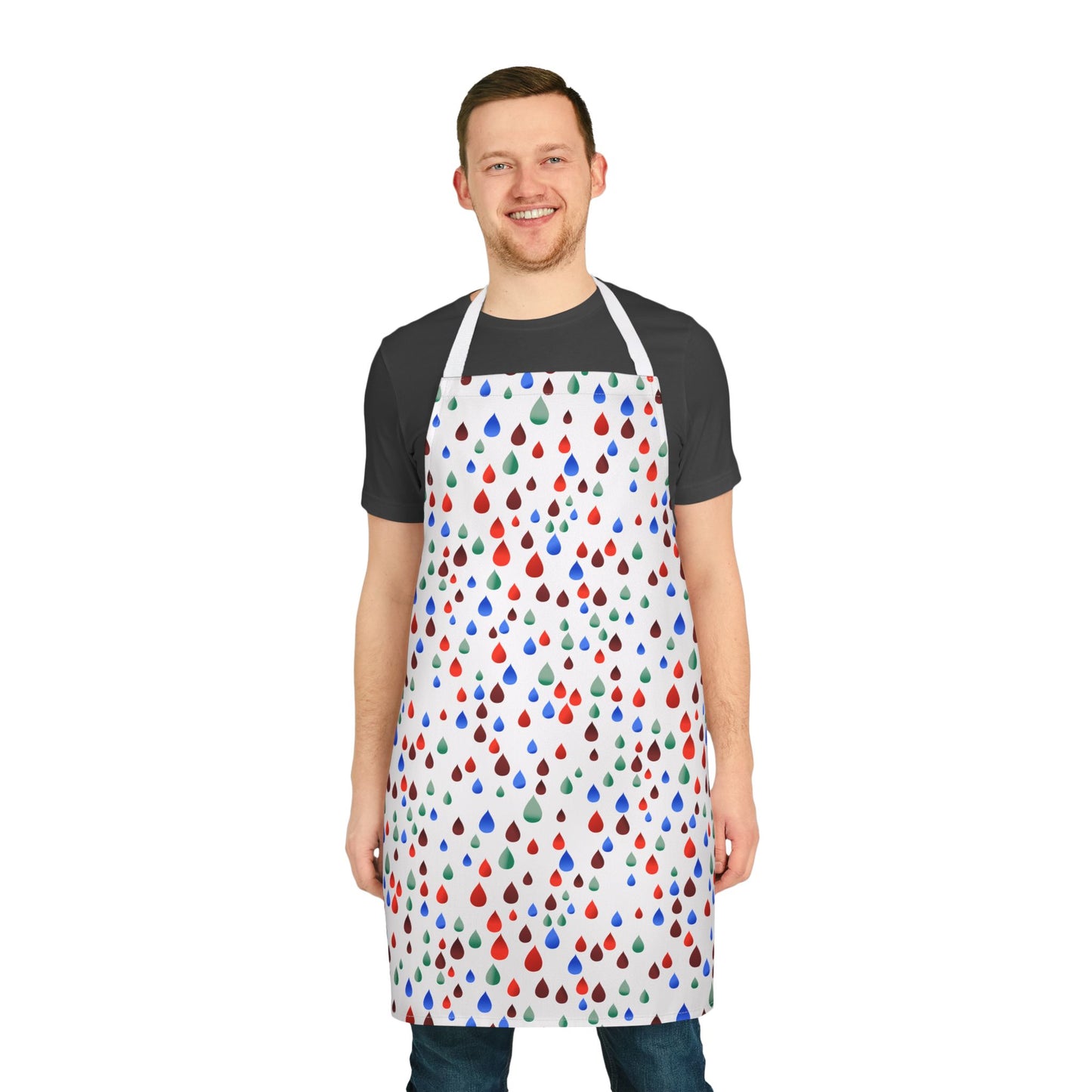 Happy Raindrops Apron features vibrant teardrop patterns on a stain-free polyester canvas, expertly modeled by a smiling man in a dark T-shirt, epitomizing FireBrook Essentials' joy-infused, practical design ethos.