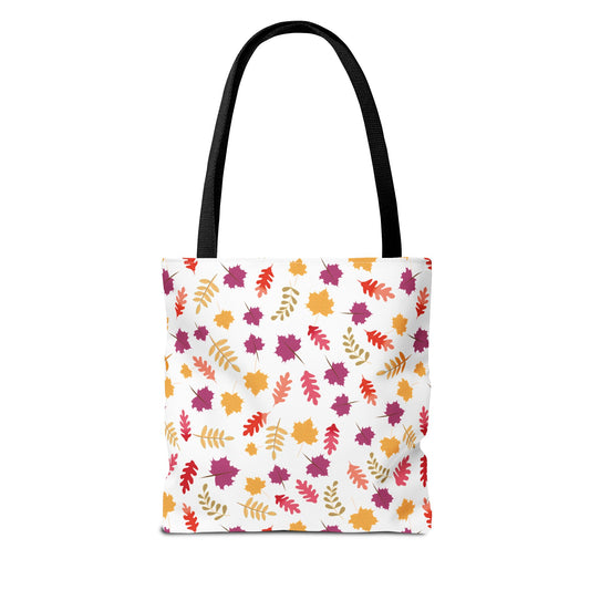 Autumn Leaves Tote Bag: A stylish, white reusable bag adorned with red, orange, gold, and purple autumn leaves, featuring black shoulder straps and reinforced stitching, perfect for daily essentials.