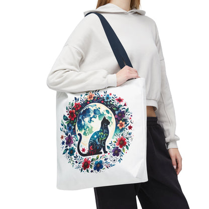 Lone Cat Under the Moon Tote Bag features a whimsical feline design, perfect for cat lovers. Durable polyester, boxed corners, and reinforced handles offer practicality and style, aligning with FireBrook Essentials' uplifting ethos.