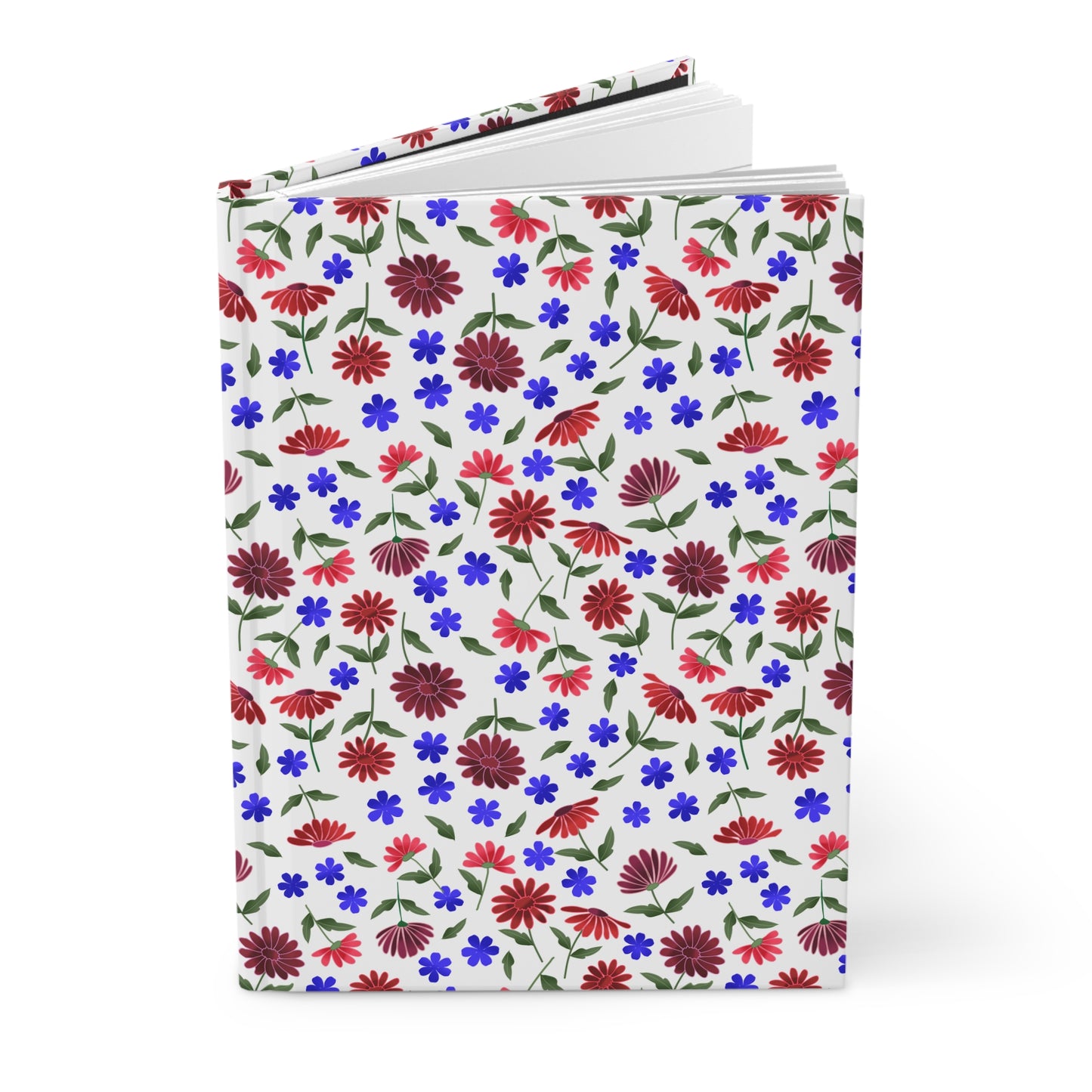 Floral Ditsy Hardcover Journal — Red & Blue Wildflower Notebook: A hardcover journal with vibrant red and blue flowers on a white background, showcasing a lively floral pattern. Pages peek out, suggesting a blank interior.