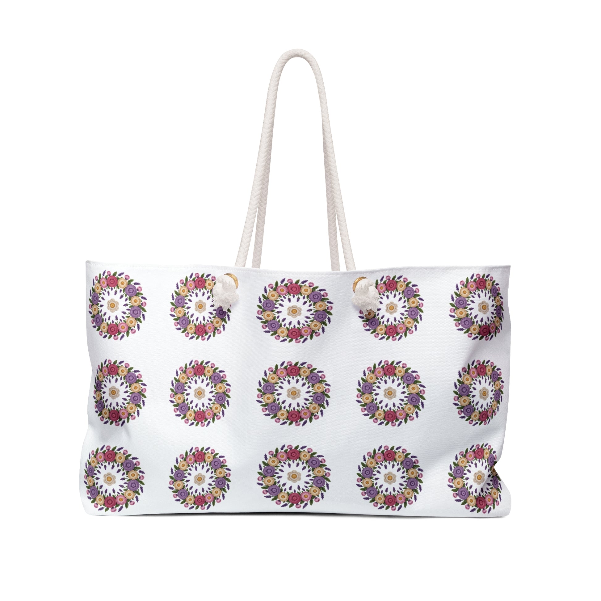 Crochet Floral Weekender Bag with detailed crochet floral pattern and cream background. Spacious, stylish bag for weekend getaways, featuring comfortable cotton rope handles and luxurious cream sheeting interior lining.