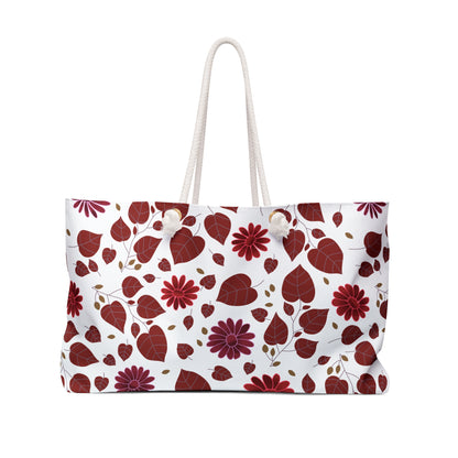 Weekender Bag with a vibrant red-leaf and flower motif, features sturdy rope handles and spacious design. Ideal for stylish travel, embodying FireBrook Essentials' commitment to joyful, practical living.