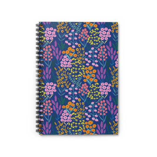 Floral Spiral Notebook with vibrant wildflower pattern, featuring pink blooms and green leaves on a navy cover. Black wire binding for easy page turning, ideal for creative notes and sketches.
