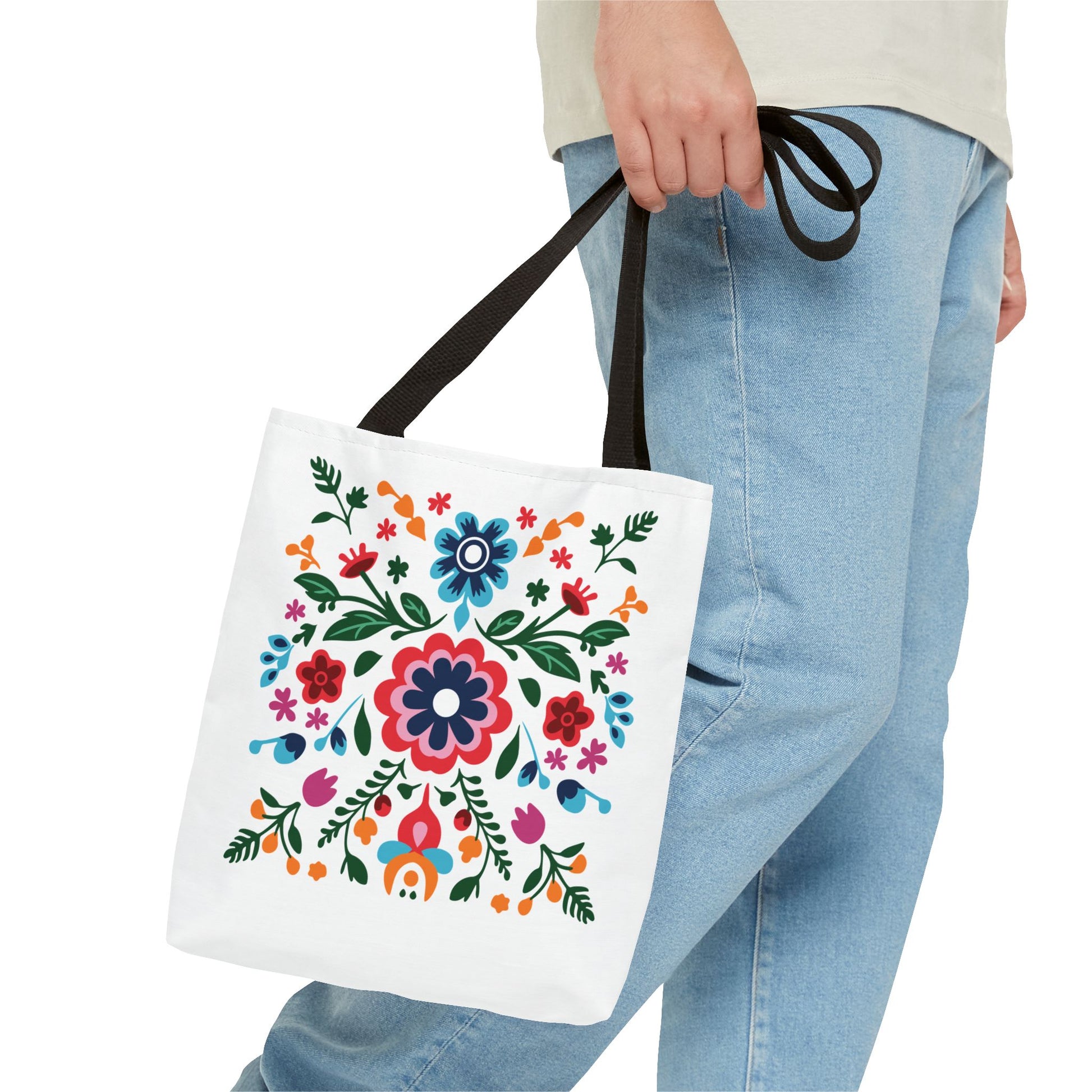 Floral Tote Bag held by person, showcasing a vibrant floral pattern. Ideal for daily use, combining style and practicality, from FireBrook Essentials.