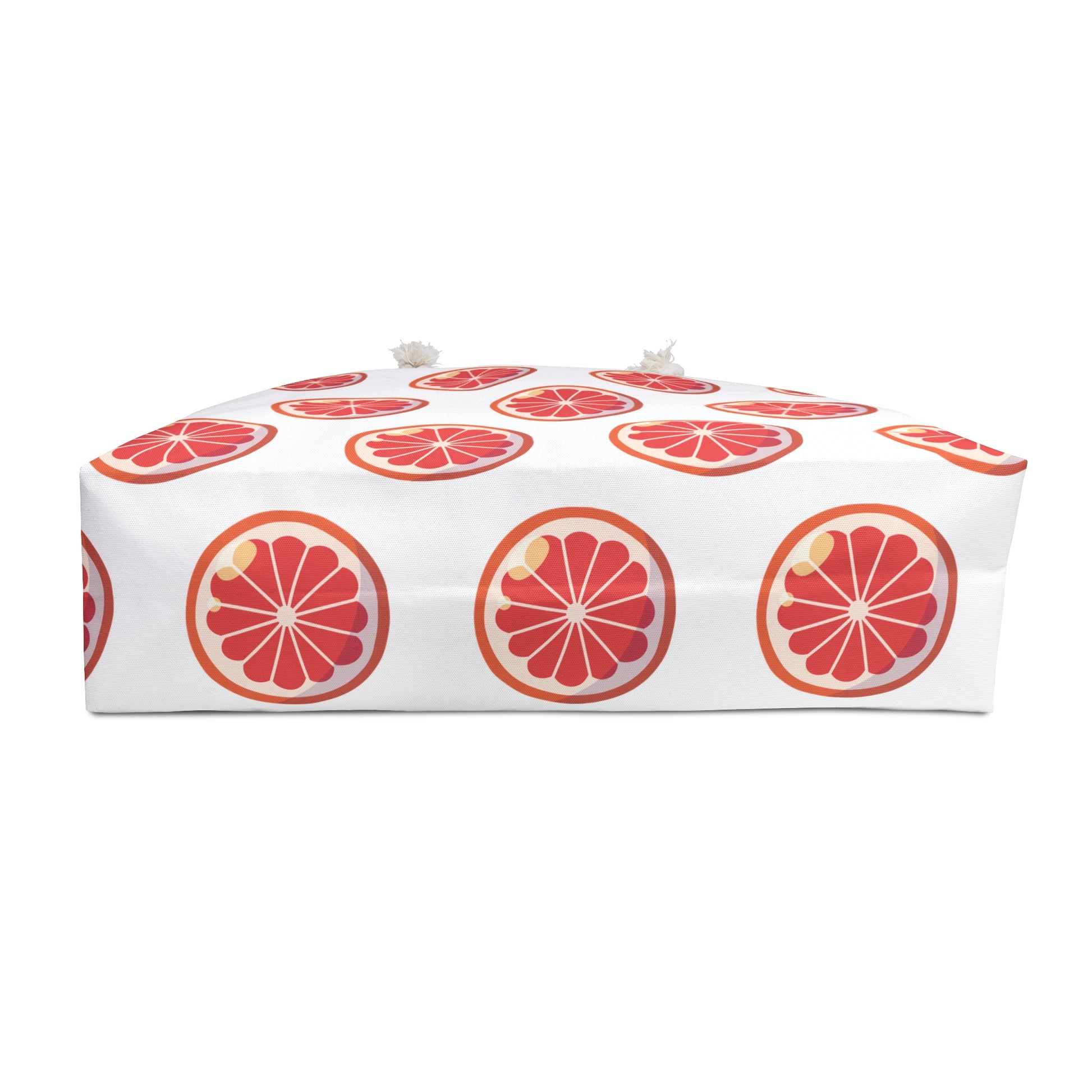 Weekender Bag Orange Slices Print showcasing vibrant orange slice patterns, perfect for summer getaways, features durable rope handles and generous storage, embodying FireBrook Essentials' uplifting and stylish design ethos.