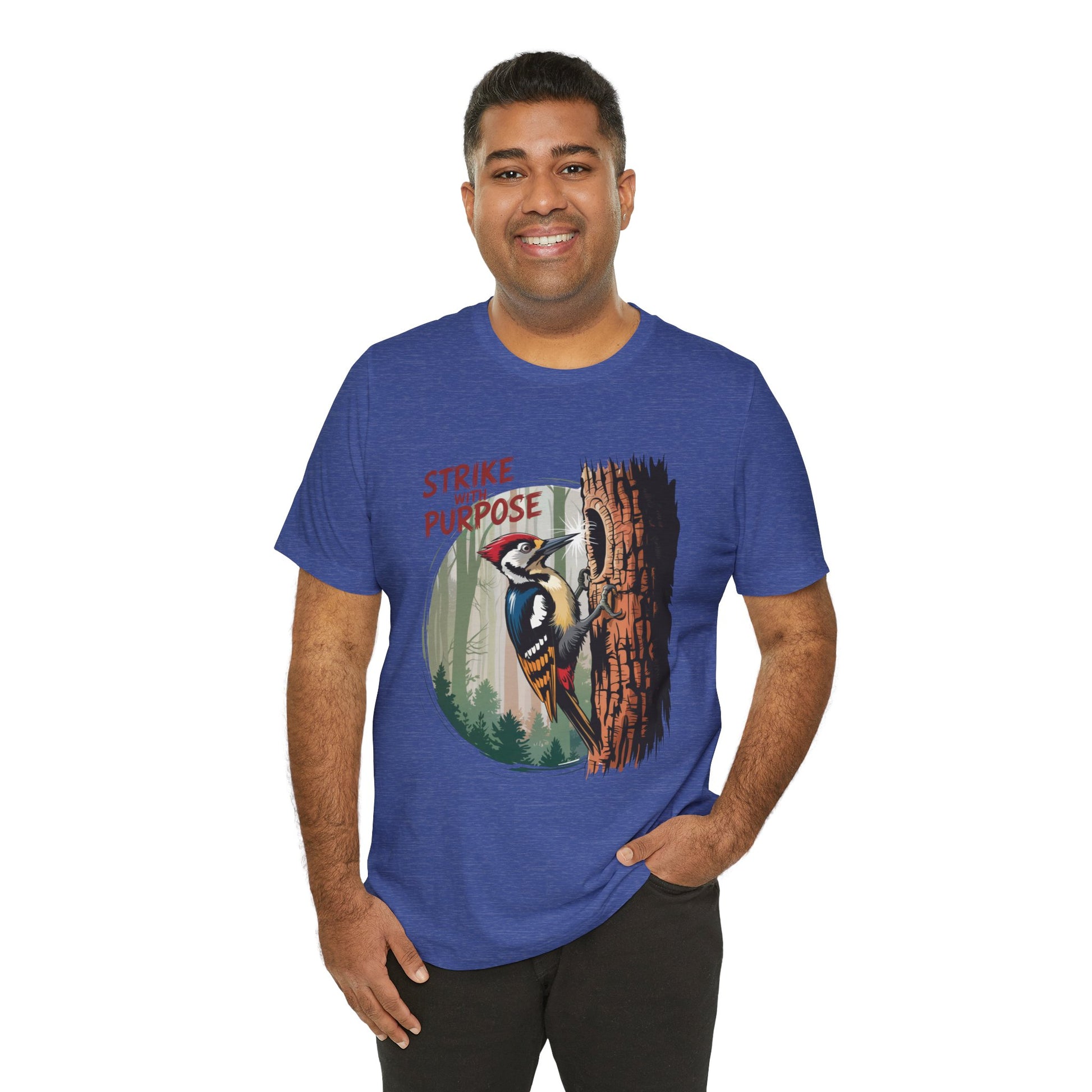 Woodpecker: Strike with a Purpose Bella+Canvas Unisex T-Shirt featuring a bold woodpecker design, worn by a smiling man, exuding motivation and ideal for casual, nature-inspired style.