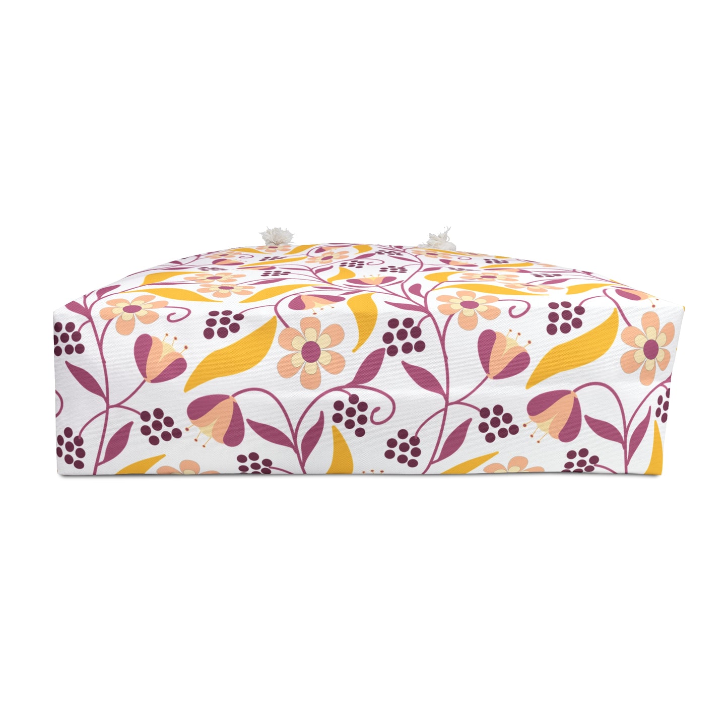 Weekender Bag with a spacious design features a floral-and-vine patterned fabric, showcasing stylized flowers and leaves in pink, peach, and mustard hues, complemented by practical rope handles for easy carrying.
