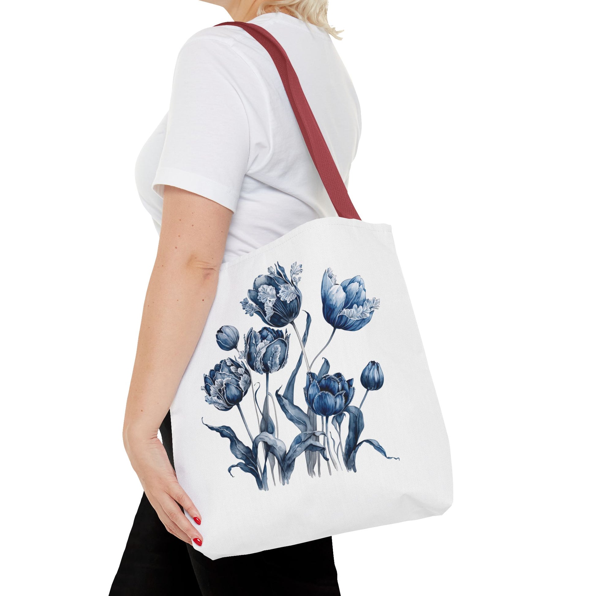 Flowers in Blue Hue Watercolor Tote Bag carried by a woman, showcasing its floral design and practical size, ideal for stylish functionality.