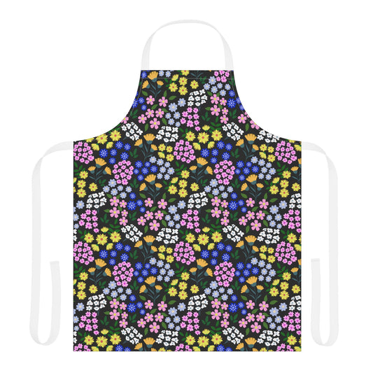 Apron Floral Design: A vibrant apron with a multicolored floral pattern, featuring a white neck loop and ties, crafted from soft, stain-free polyester canvas, perfect for joyful, stylish cooking and crafting.