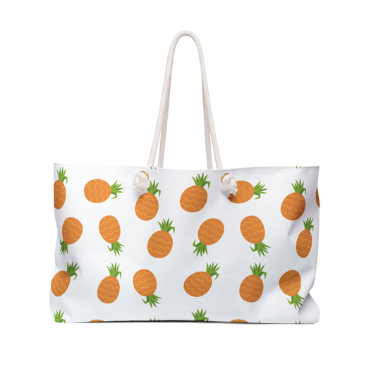 Weekender Bag - Pineapple Pattern: A stylish tote with orange pineapples, cream rope handles, and a spacious interior, perfect for summer getaways and aligning with FireBrook Designs' joyful, uplifting style.