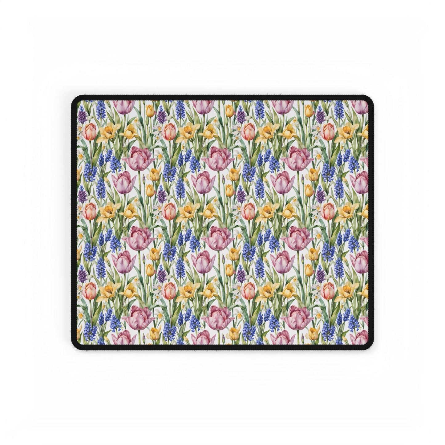 Desk Mat - Spring Garden Tulips Daffodils Hyacinths showcases a floral pattern with blooming tulips, daffodils, and hyacinths, offering a calming workspace ambiance. Ideal for nature lovers and peaceful settings.