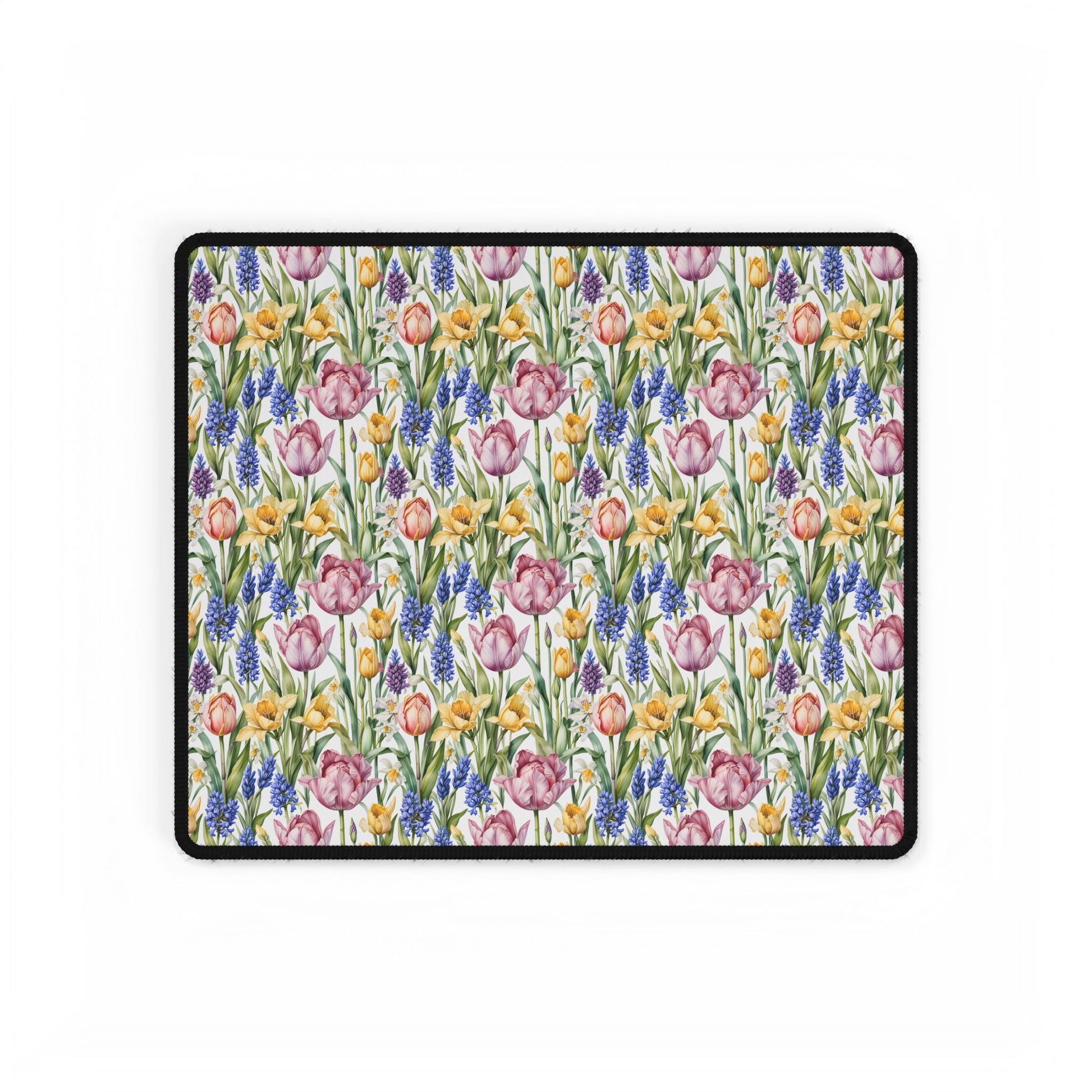 Desk Mat - Spring Garden Tulips Daffodils Hyacinths showcases a floral pattern with blooming tulips, daffodils, and hyacinths, offering a calming workspace ambiance. Ideal for nature lovers and peaceful settings.