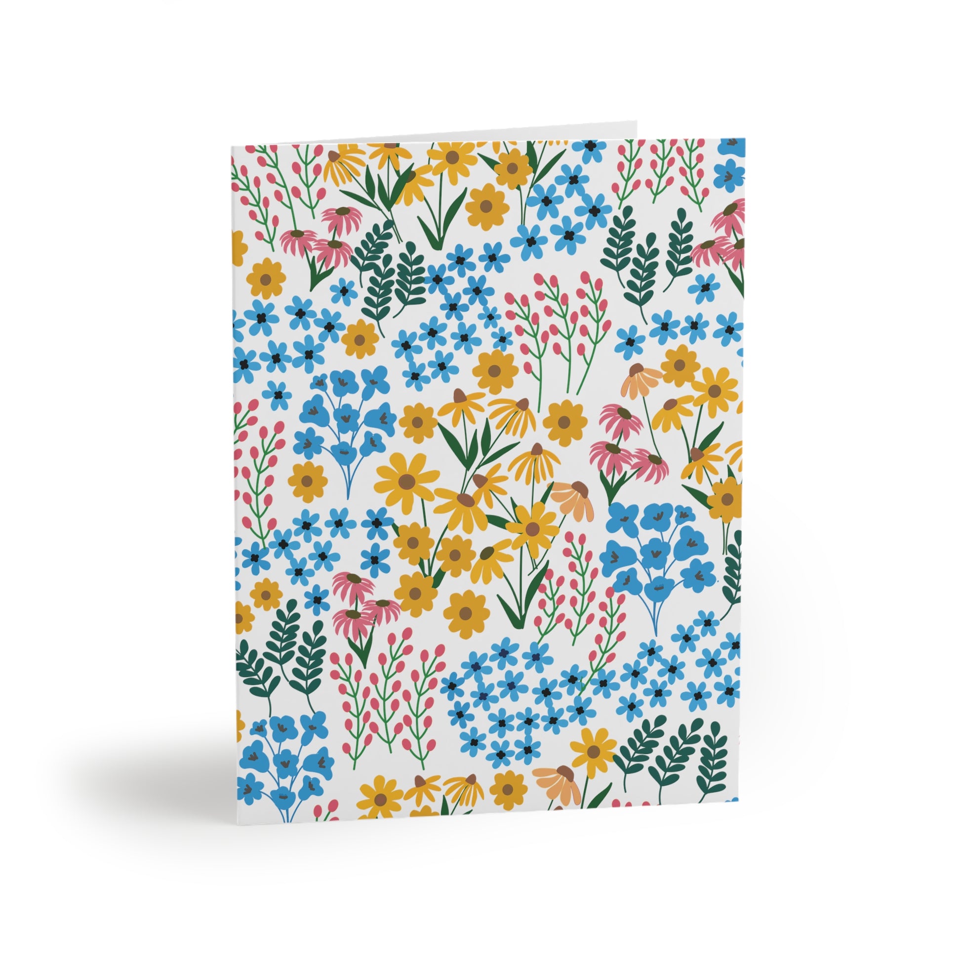 Floral Greeting Cards — Pack of 8/16/24 featuring hand-drawn daisies, forget-me-nots, coneflowers, and leafy stems on a white background, exuding springtime cheer. Comes folded with matching envelopes.