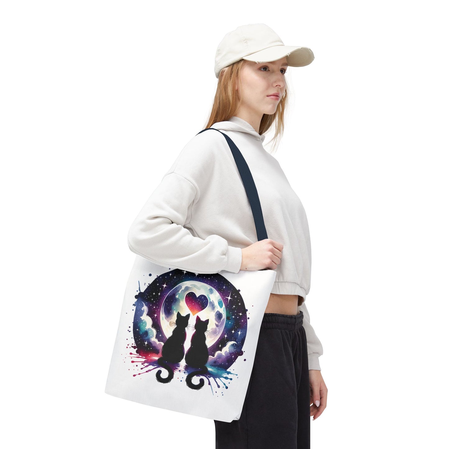 Copy of Cat Lovers Under the Moon Tote Bag featuring a whimsical cat design, perfect for carrying essentials. With durable polyester, boxed corners, and reinforced handles, it’s ideal for adding feline charm to daily activities.