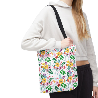 Spring Floral Patch Tote Bag with a vibrant floral pattern of yellow, pink, purple, and red flowers. The lightweight, durable design is perfect for summer outings, offering style and functionality with reinforced handles.